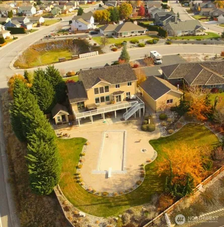 an aerial view of a house with a swimming pool