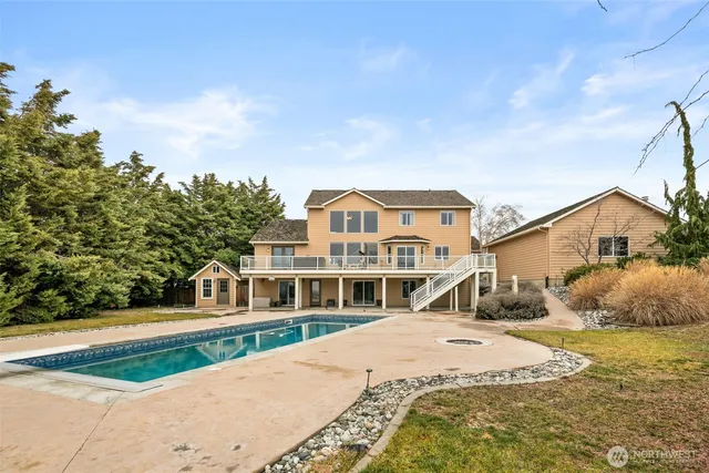 a view of swimming pool from a yard