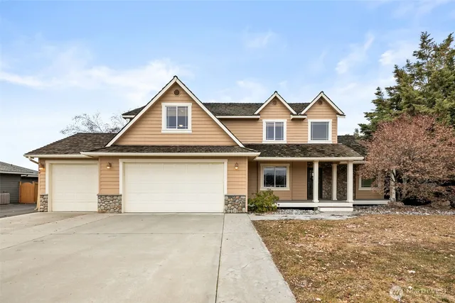 a front view of a house with yard