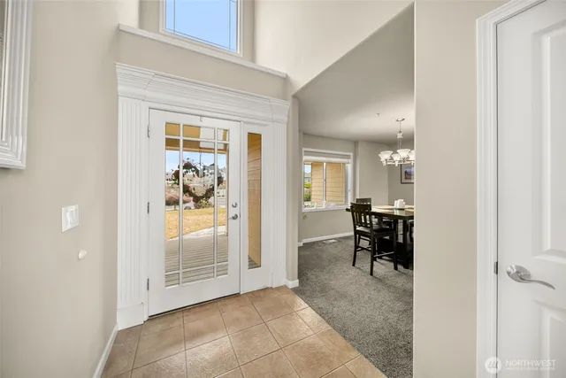 a view of a livingroom and a dining room with furniture and a livingroom