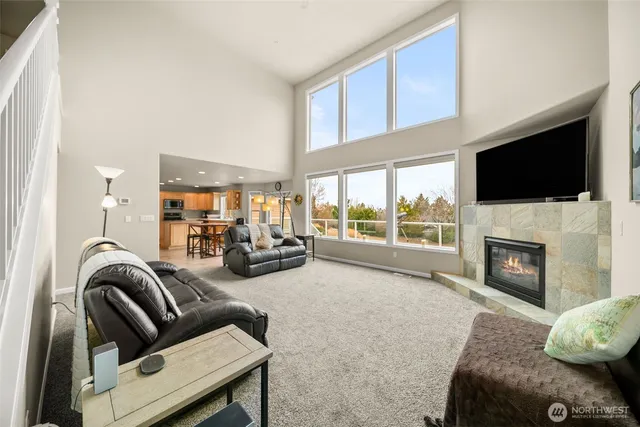 a living room with furniture fireplace and a flat screen tv