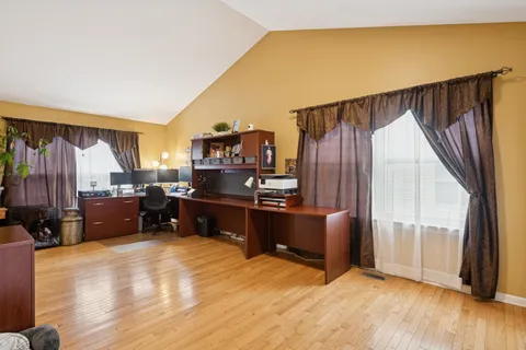 a room with furniture and a wooden floor