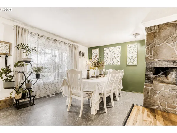 a view of a dining room with furniture window and outside view