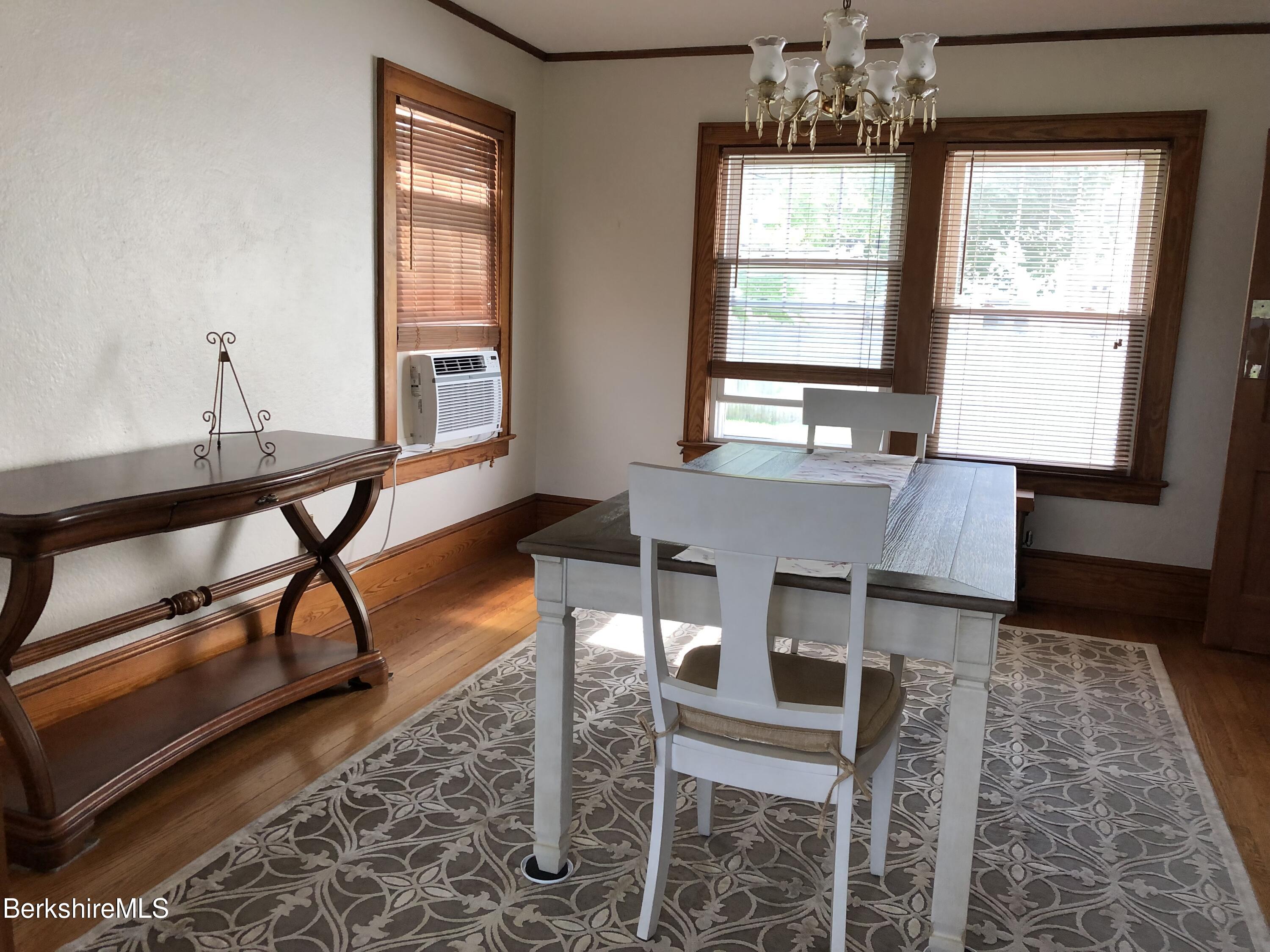 9 Weston Street Pittsfield, MA 01201 - Photo 11 of 45 a dining room with table and chairs
