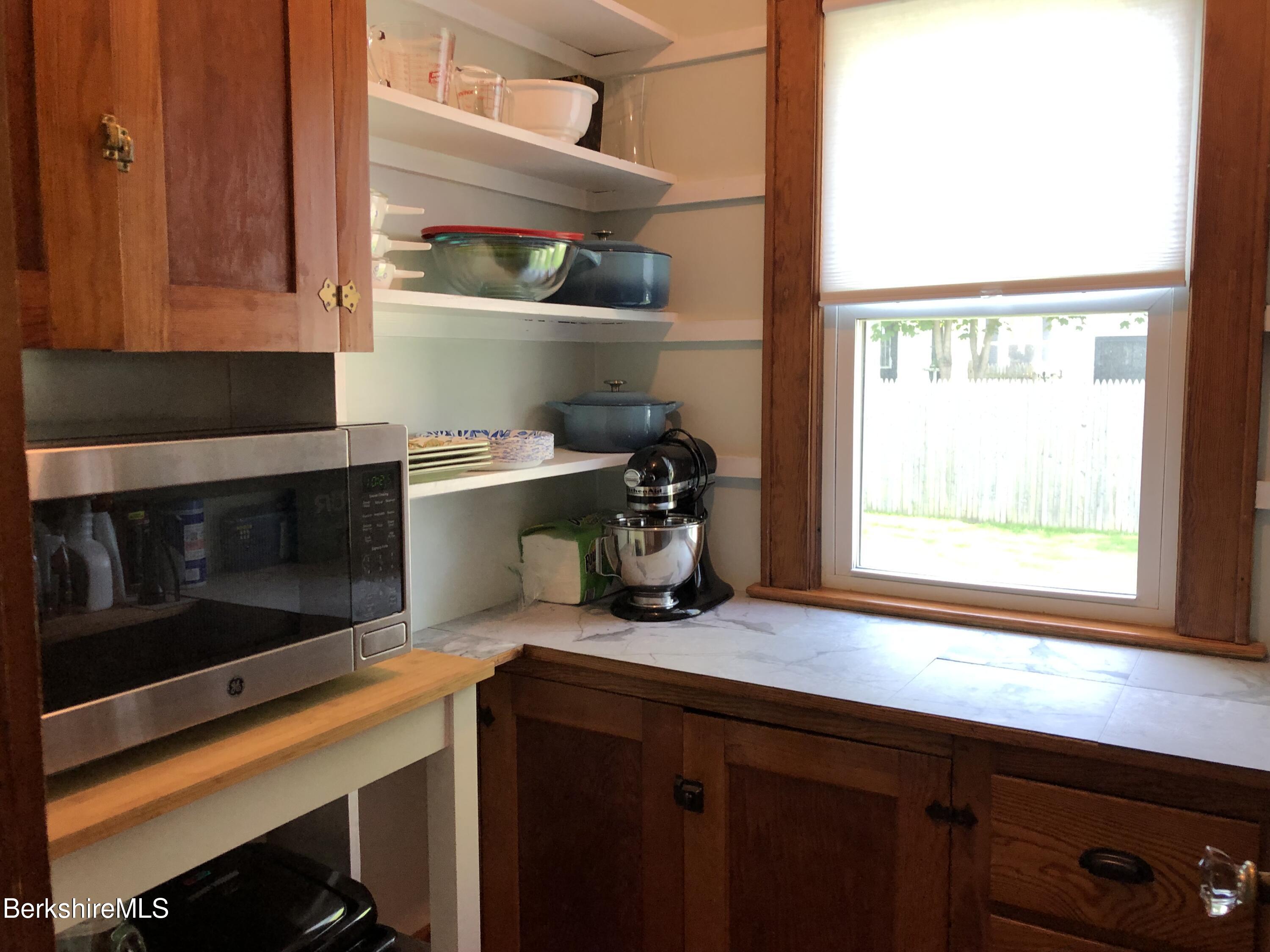 9 Weston Street Pittsfield, MA 01201 - Photo 21 of 45 a kitchen with a stove and a microwave