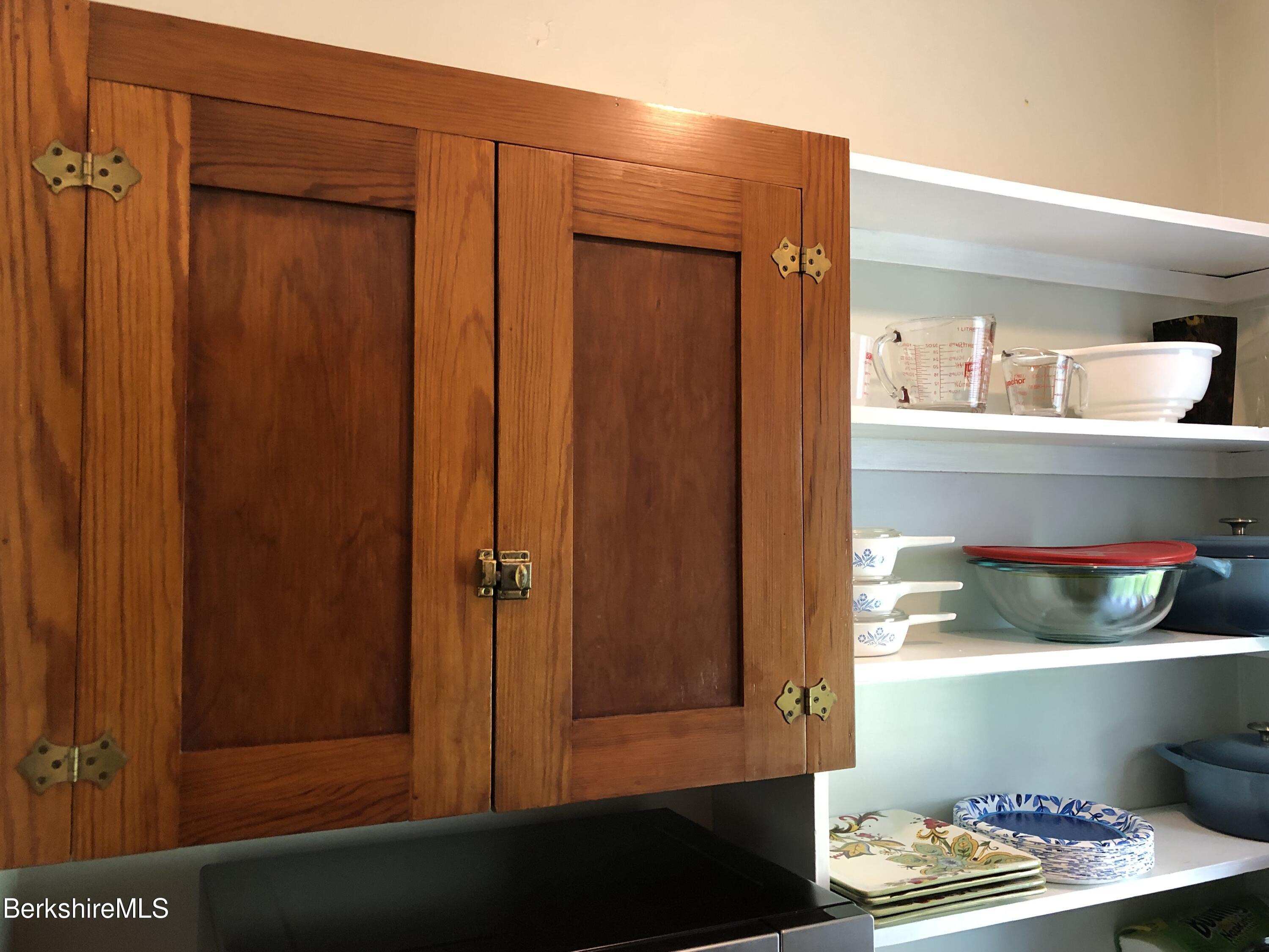 9 Weston Street Pittsfield, MA 01201 - Photo 22 of 45 a room with shelves and wooden shelves