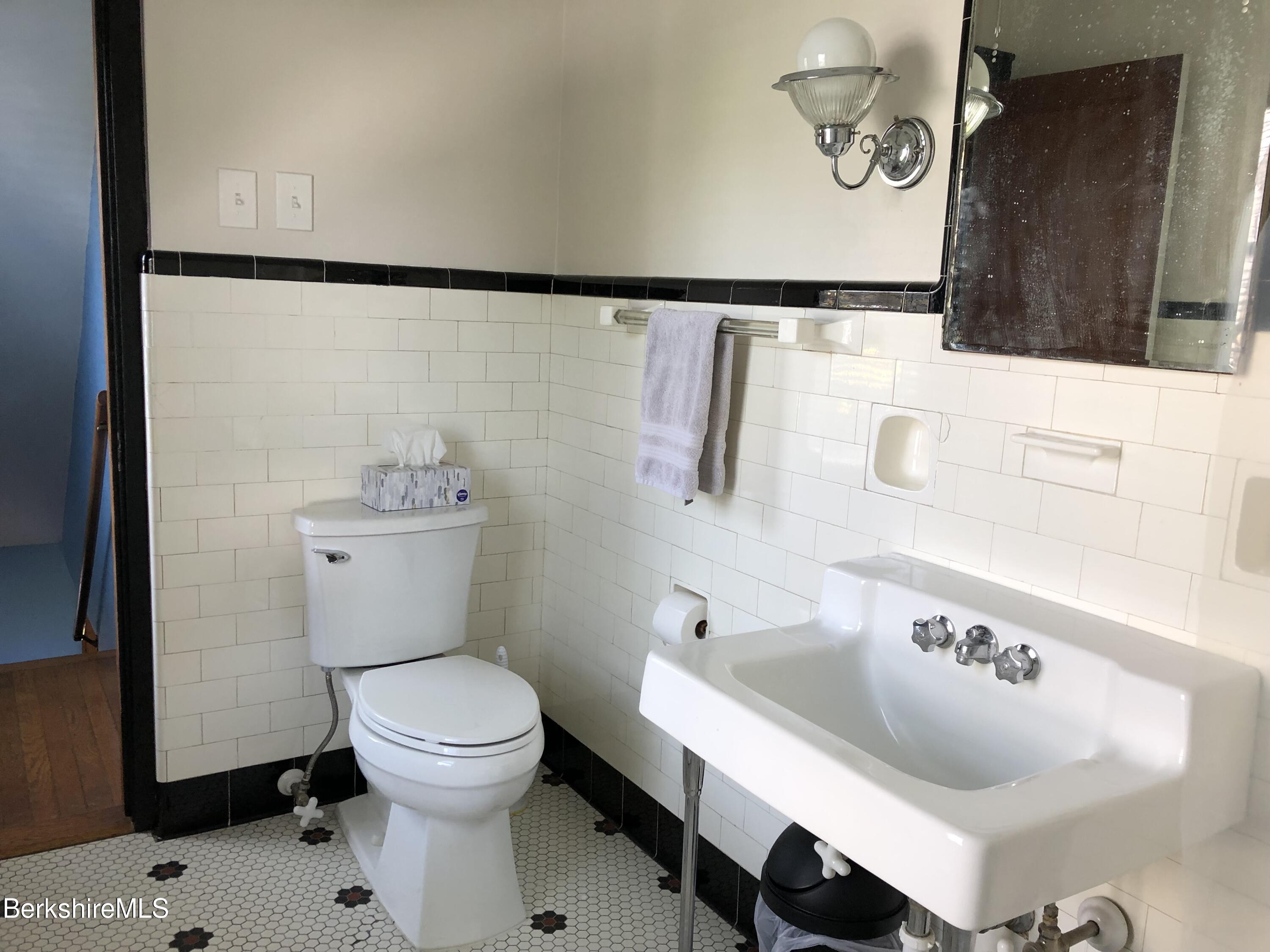 9 Weston Street Pittsfield, MA 01201 - Photo 25 of 45 a bathroom with a sink a toilet and a mirror