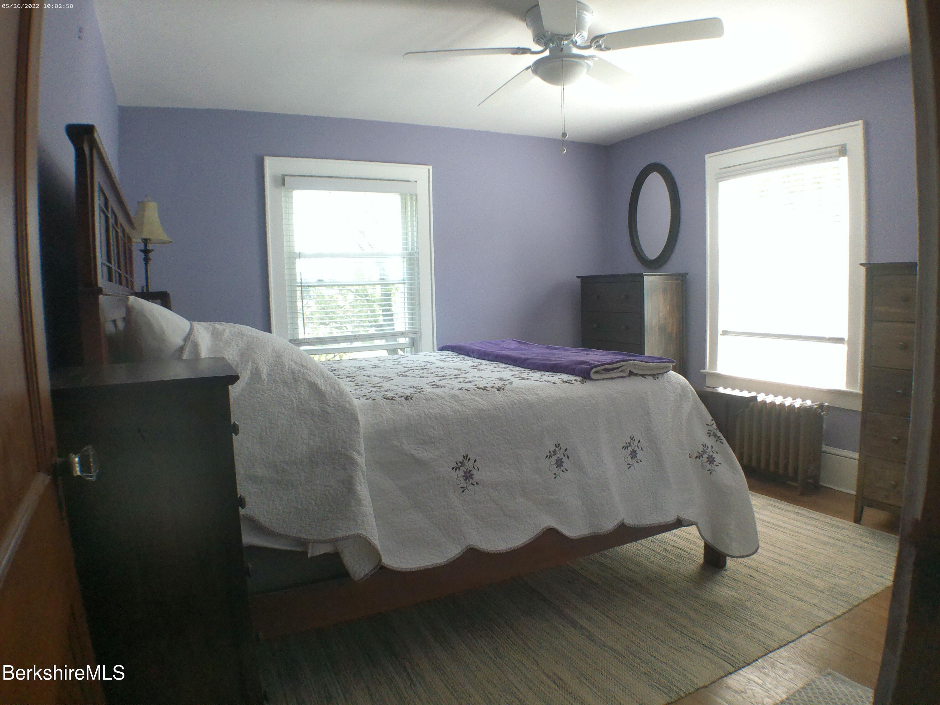 9 Weston Street Pittsfield, MA 01201 - Photo 32 of 45 a bed sitting in a bedroom next to a window