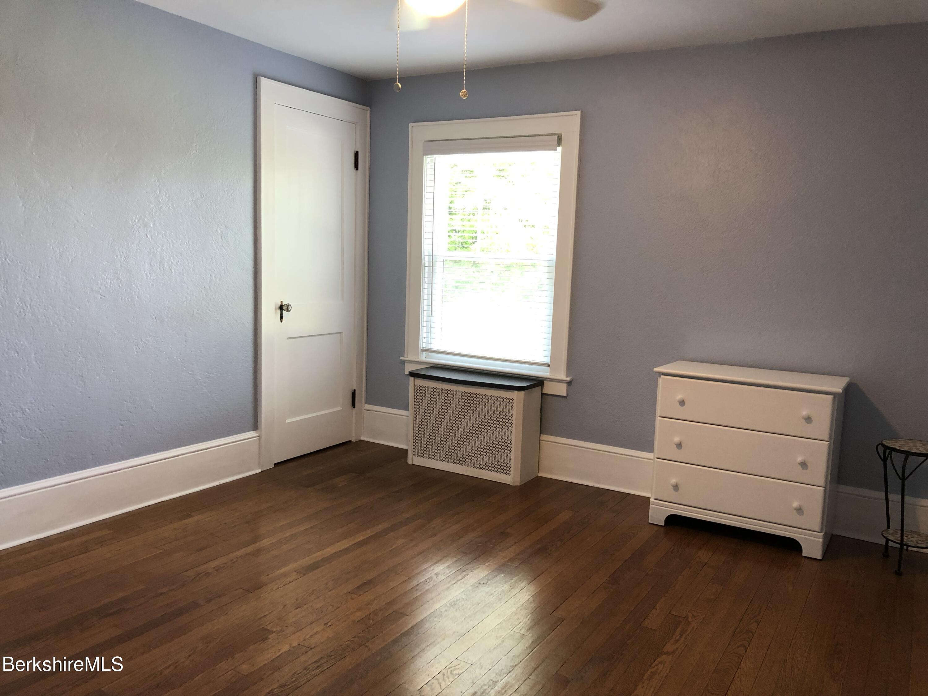 9 Weston Street Pittsfield, MA 01201 - Photo 35 of 45 an empty room with a hardwood and a window
