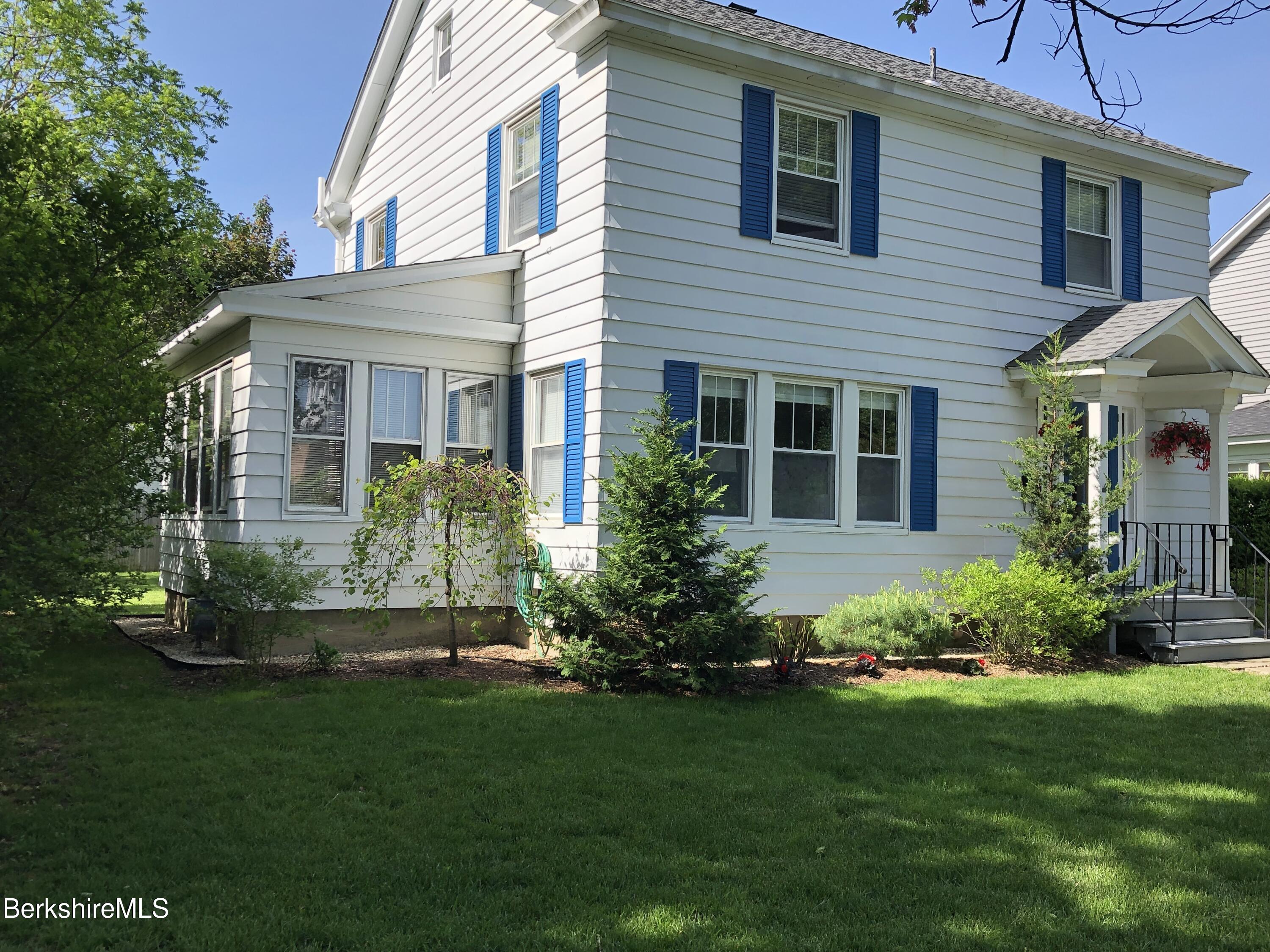 9 Weston Street Pittsfield, MA 01201 - Photo 4 of 45 a front view of a house with a garden and plants