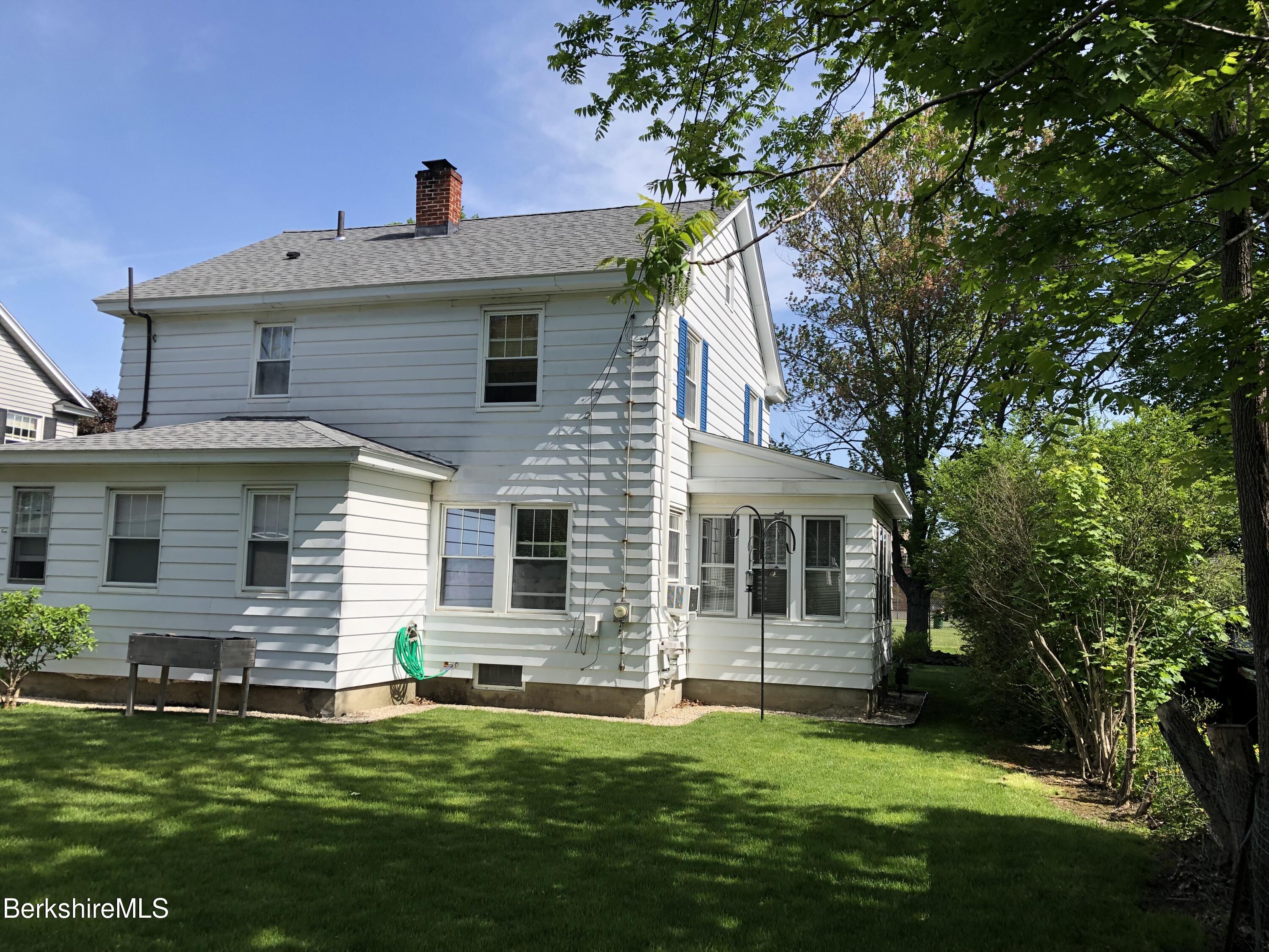 9 Weston Street Pittsfield, MA 01201 - Photo 5 of 45 a front view of a house with a garden