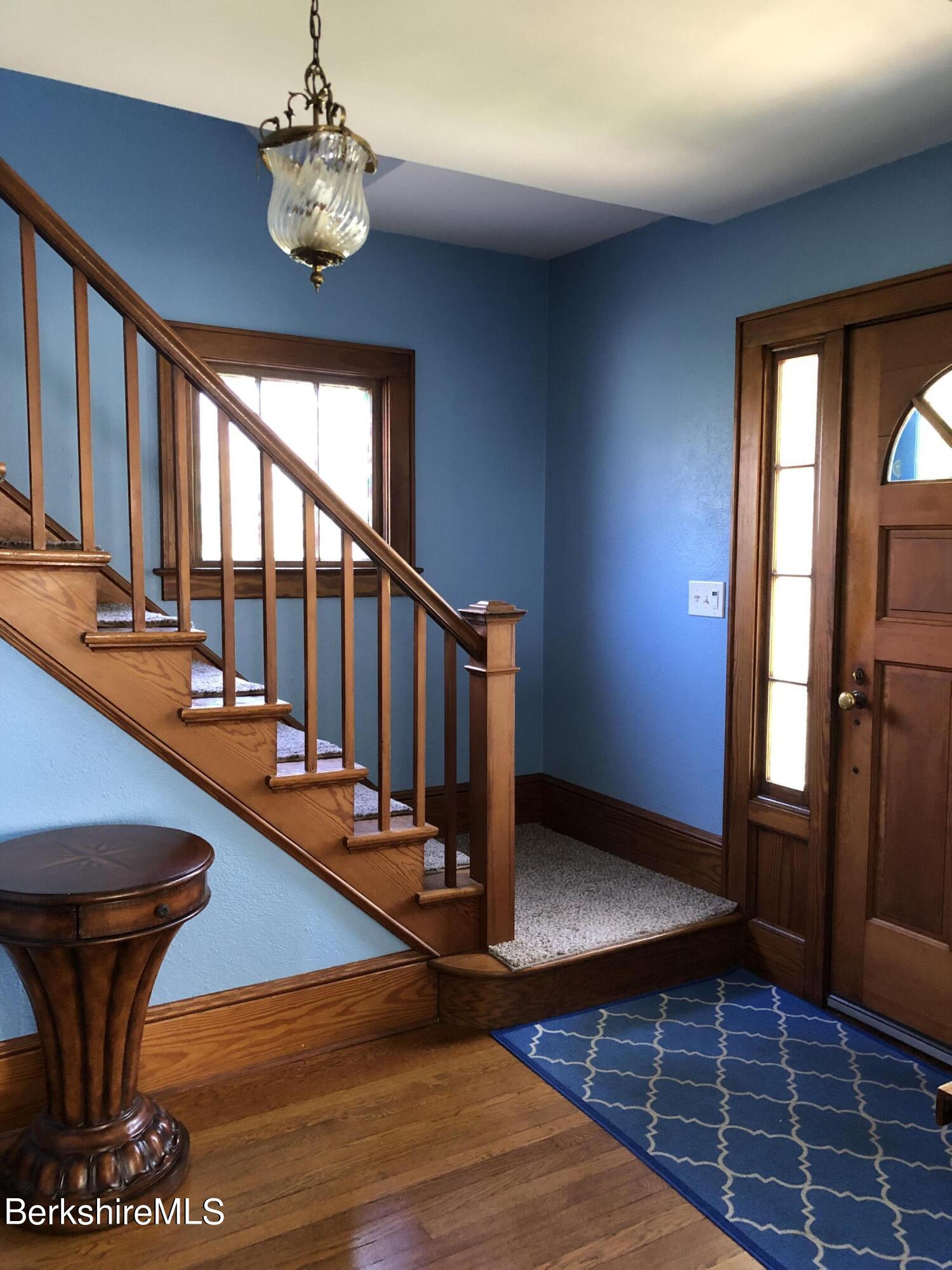 9 Weston Street Pittsfield, MA 01201 - Photo 6 of 45 a view of a livingroom with furniture staircase and a chandelier