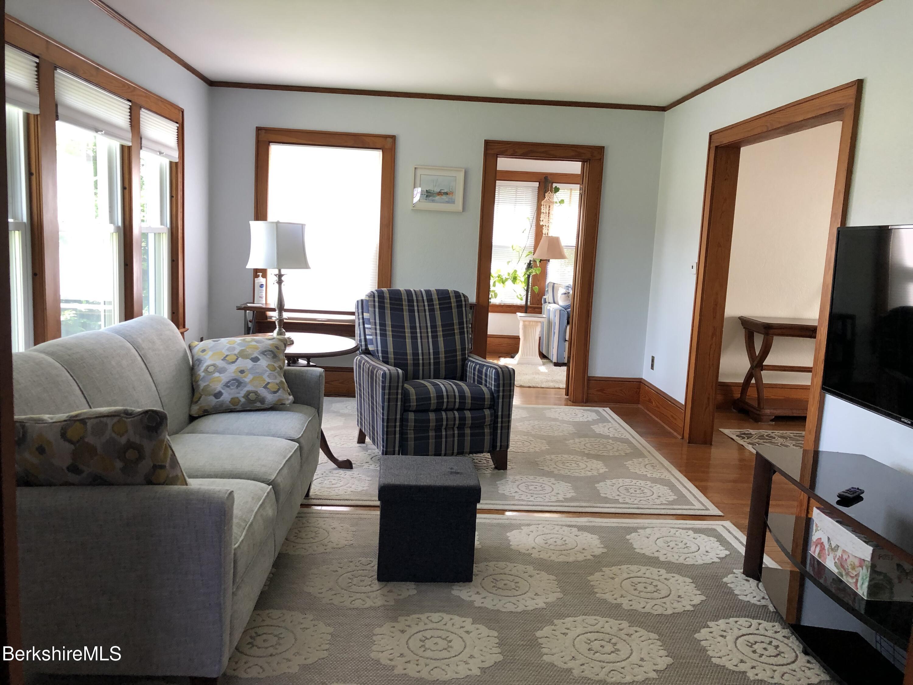 9 Weston Street Pittsfield, MA 01201 - Photo 9 of 45 a living room with furniture wooden floor and a flat screen tv