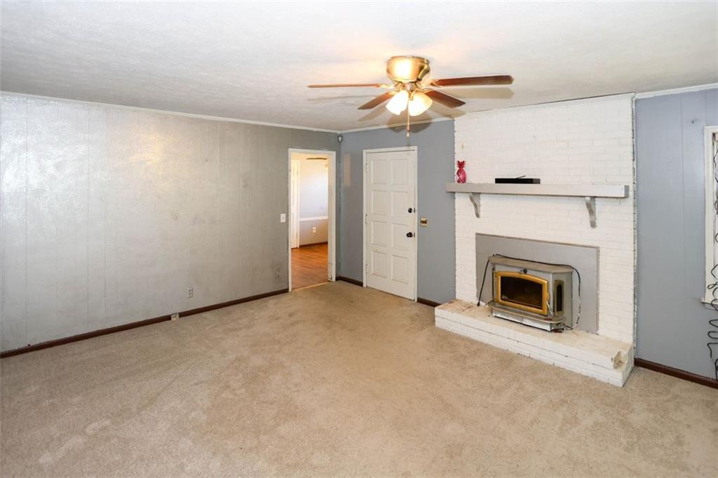 3462 Fairview Road Covington, GA 30016 - Photo 15 of 55 a view of a livingroom with a fireplace
