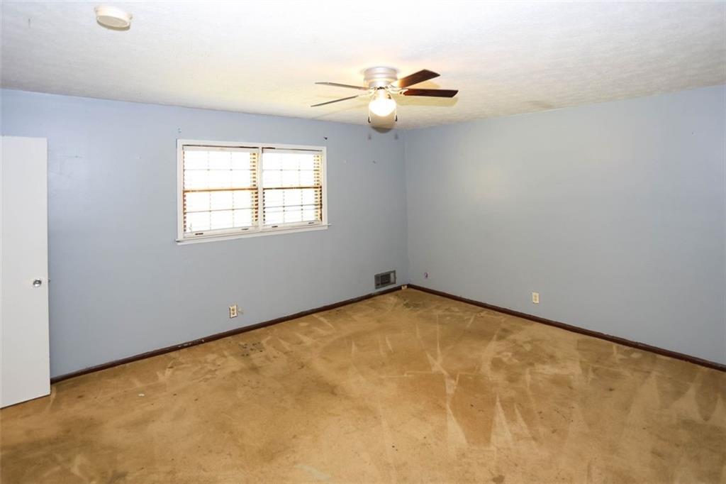 3462 Fairview Road Covington, GA 30016 - Photo 20 of 55 an empty room with a window
