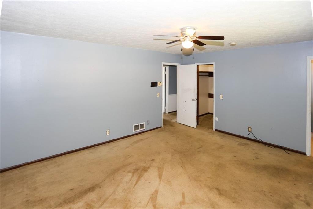 3462 Fairview Road Covington, GA 30016 - Photo 23 of 55 a view of a room with a ceiling fan