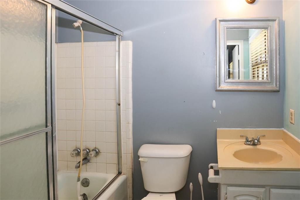 3462 Fairview Road Covington, GA 30016 - Photo 24 of 55 a bathroom with a sink toilet and shower