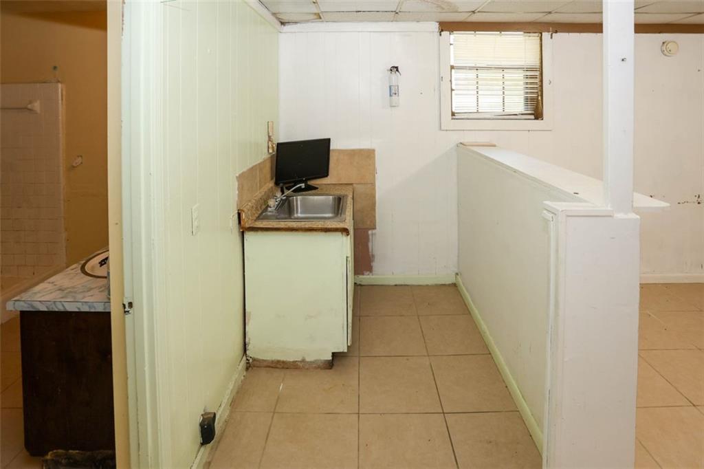 3462 Fairview Road Covington, GA 30016 - Photo 40 of 55 a view of a storage & utility room in a kitchen