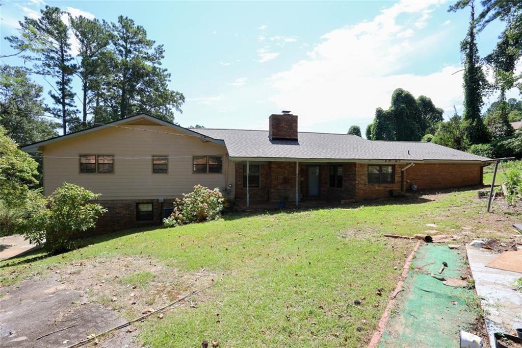 3462 Fairview Road Covington, GA 30016 - Photo 49 of 55 a front view of a house with a yard