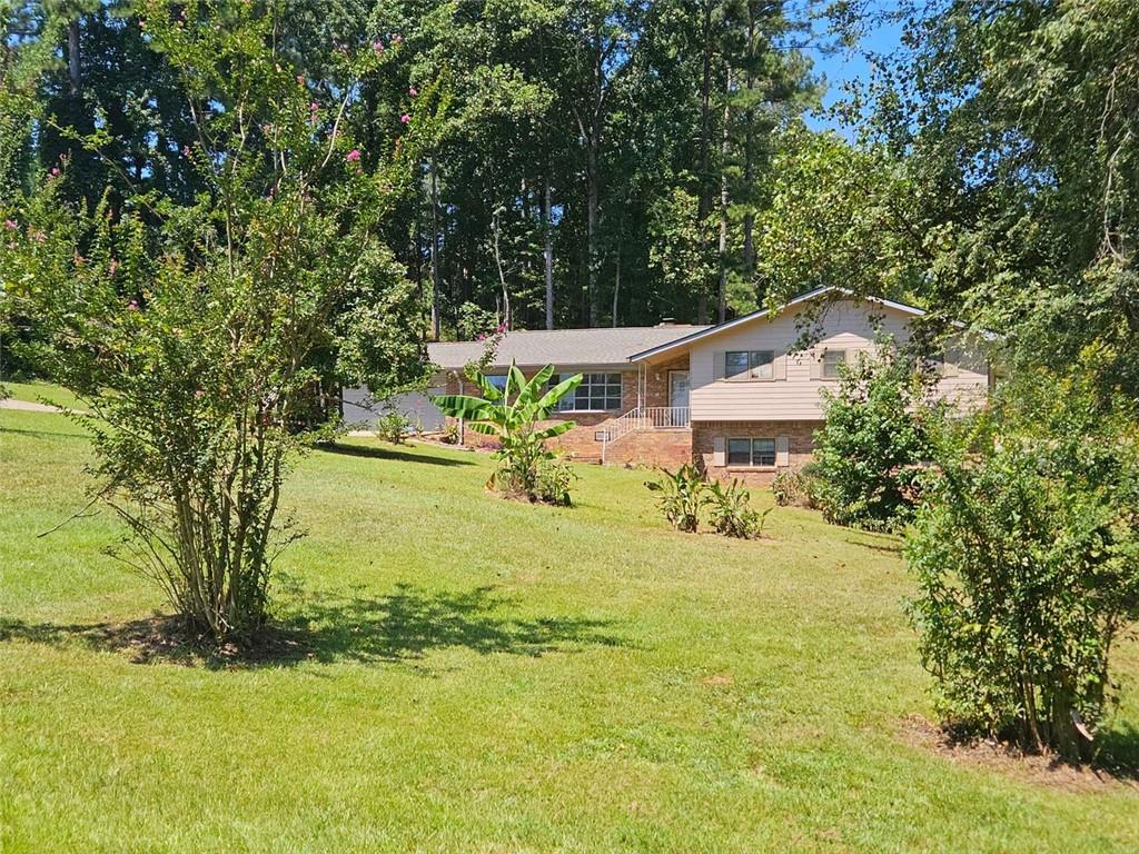 3462 Fairview Road Covington, GA 30016 - Photo 54 of 55 a view of an house with a yard