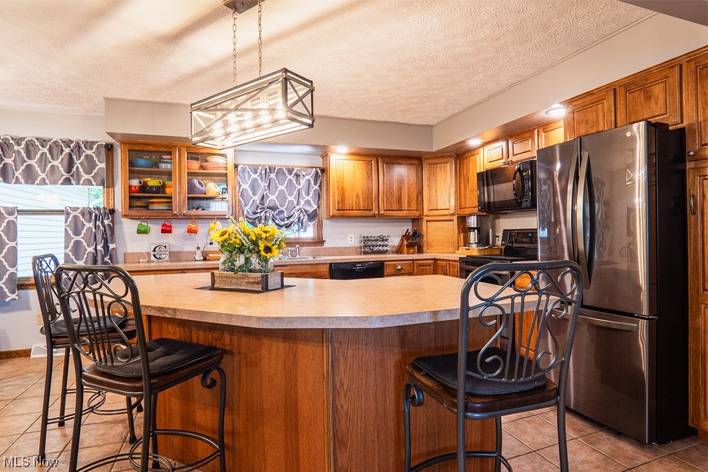 28309 Township Line Road East Rochester, OH 44625 - Photo 6 of 35 Center island in kitchen with bar stools that stay