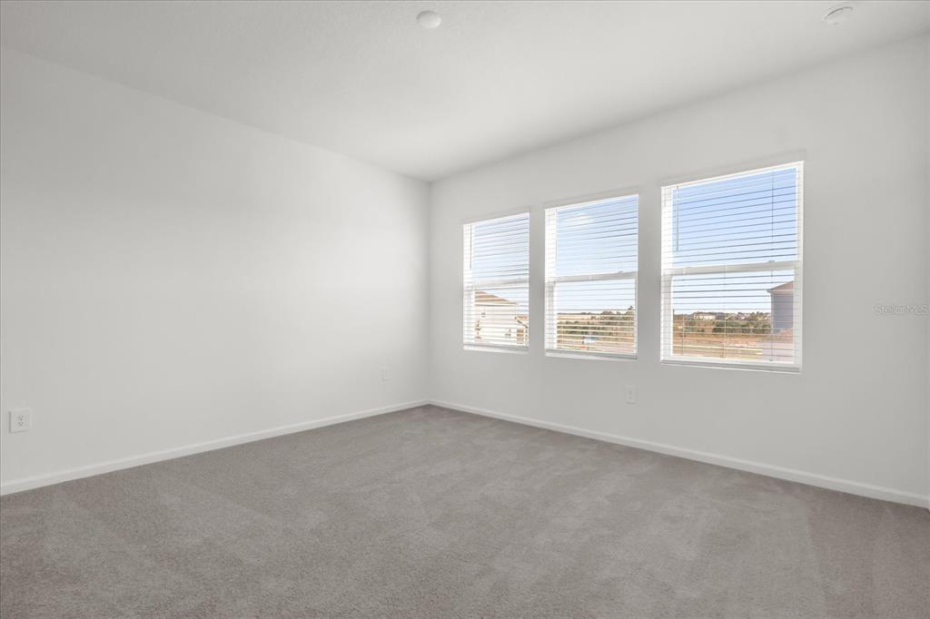 2911 Transformation Way Clermont, FL 34714 - Photo 12 of 27 an empty room with a window