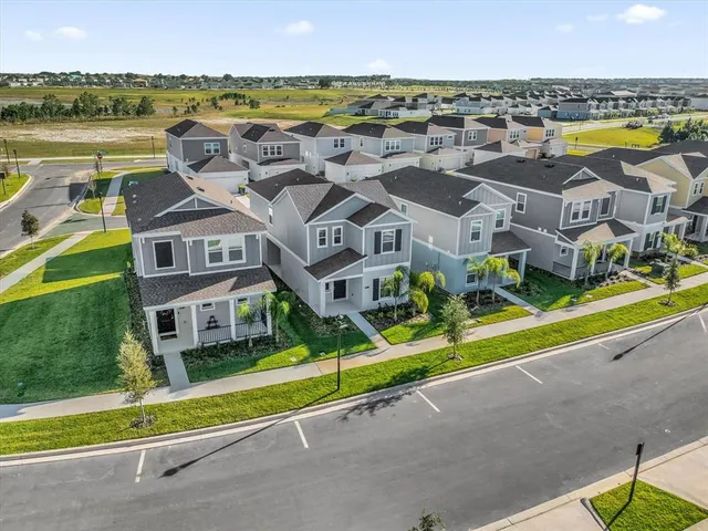a view of houses with swimming pool and ocean view