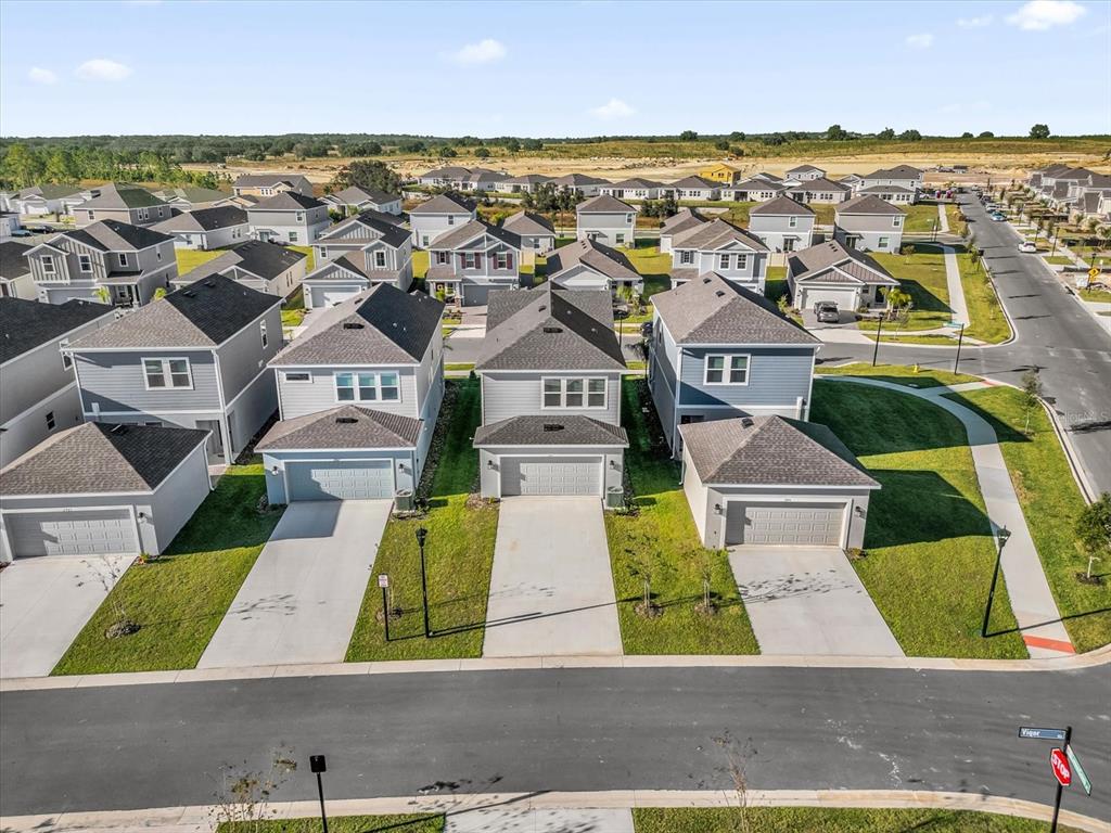 2911 Transformation Way Clermont, FL 34714 - Photo 27 of 27 an aerial view of residential houses with outdoor space and ocean view