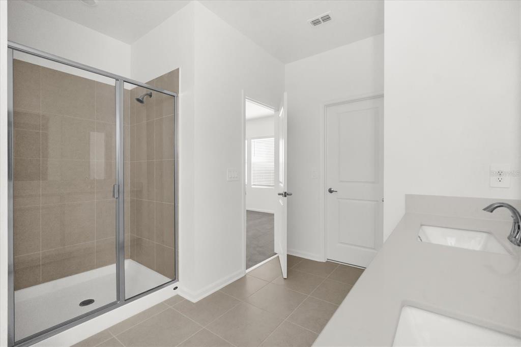 2911 Transformation Way Clermont, FL 34714 - Photo 10 of 27 a bathroom with a shower and a sink