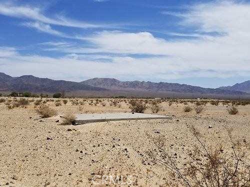 0 West Naborly Road Twentynine Palms, CA 92277 - Photo 1 of 1 a view of a lake with a mountain