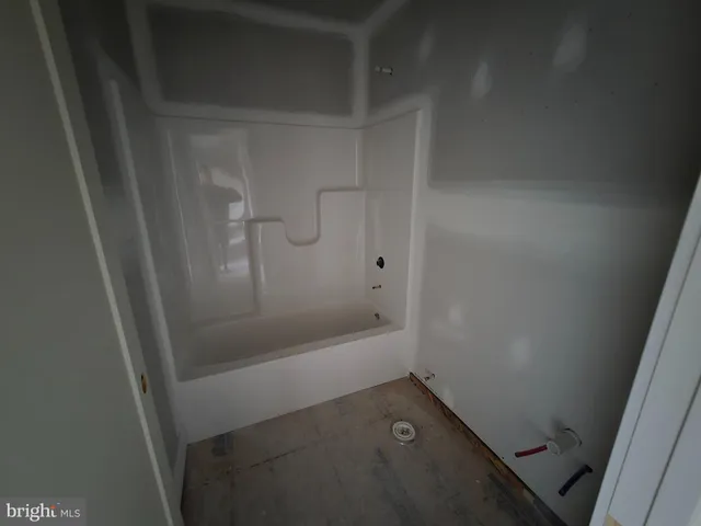 a bathroom with a granite countertop sink