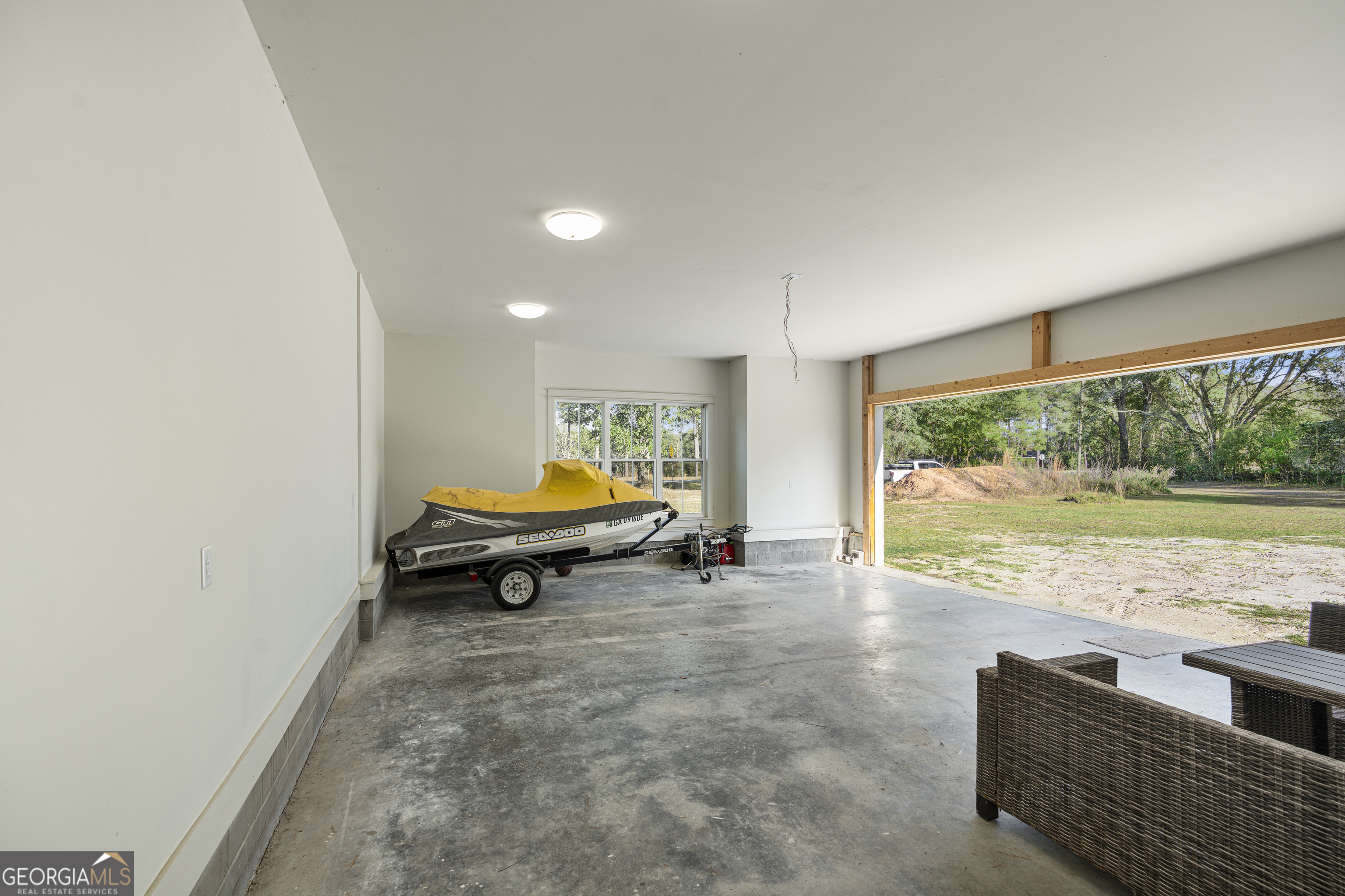 4005 Golfview Drive Blackshear, GA 31516 - Photo 21 of 40 a room with furniture and a large window