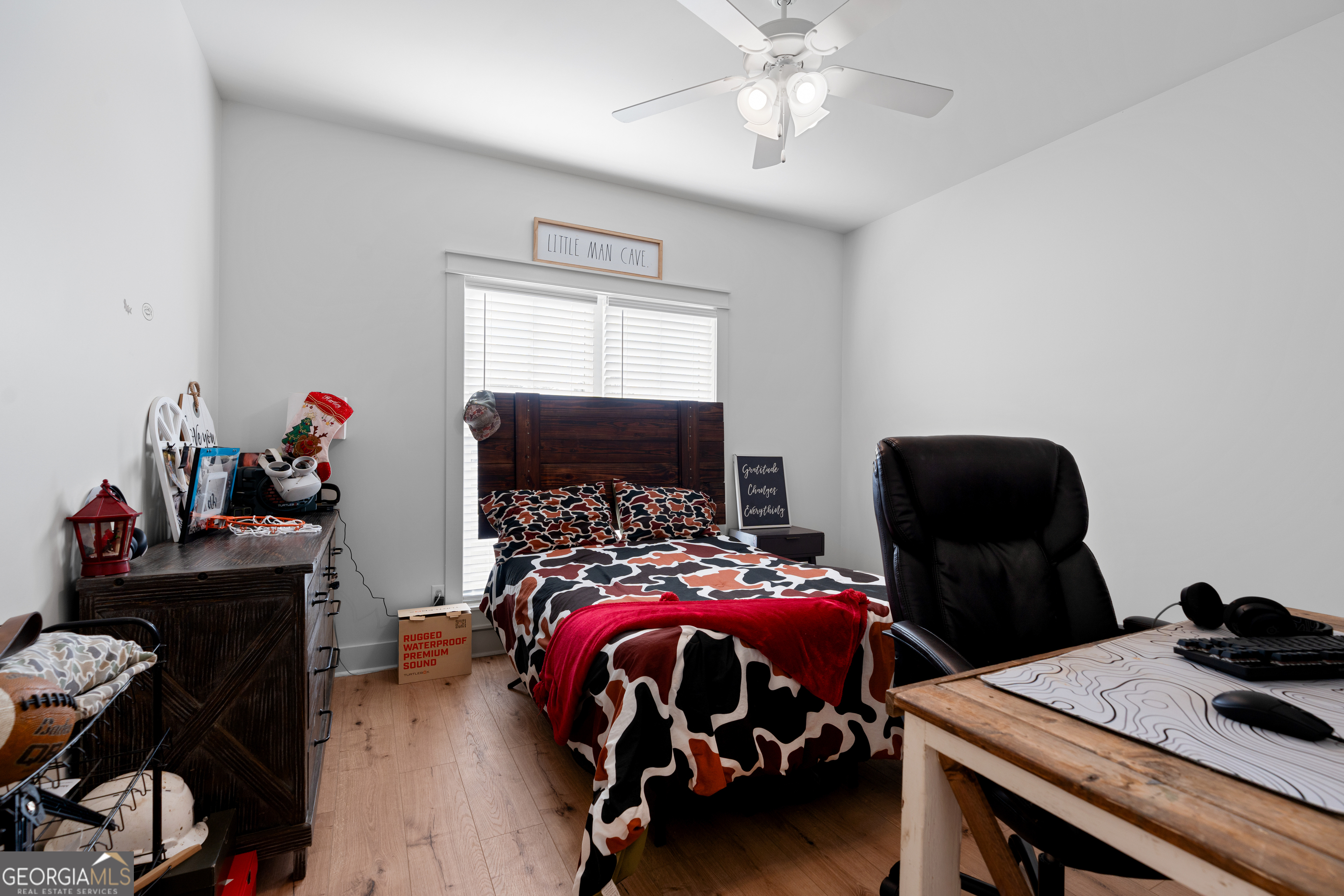 4005 Golfview Drive Blackshear, GA 31516 - Photo 23 of 40 a bedroom with a bed and a chandelier