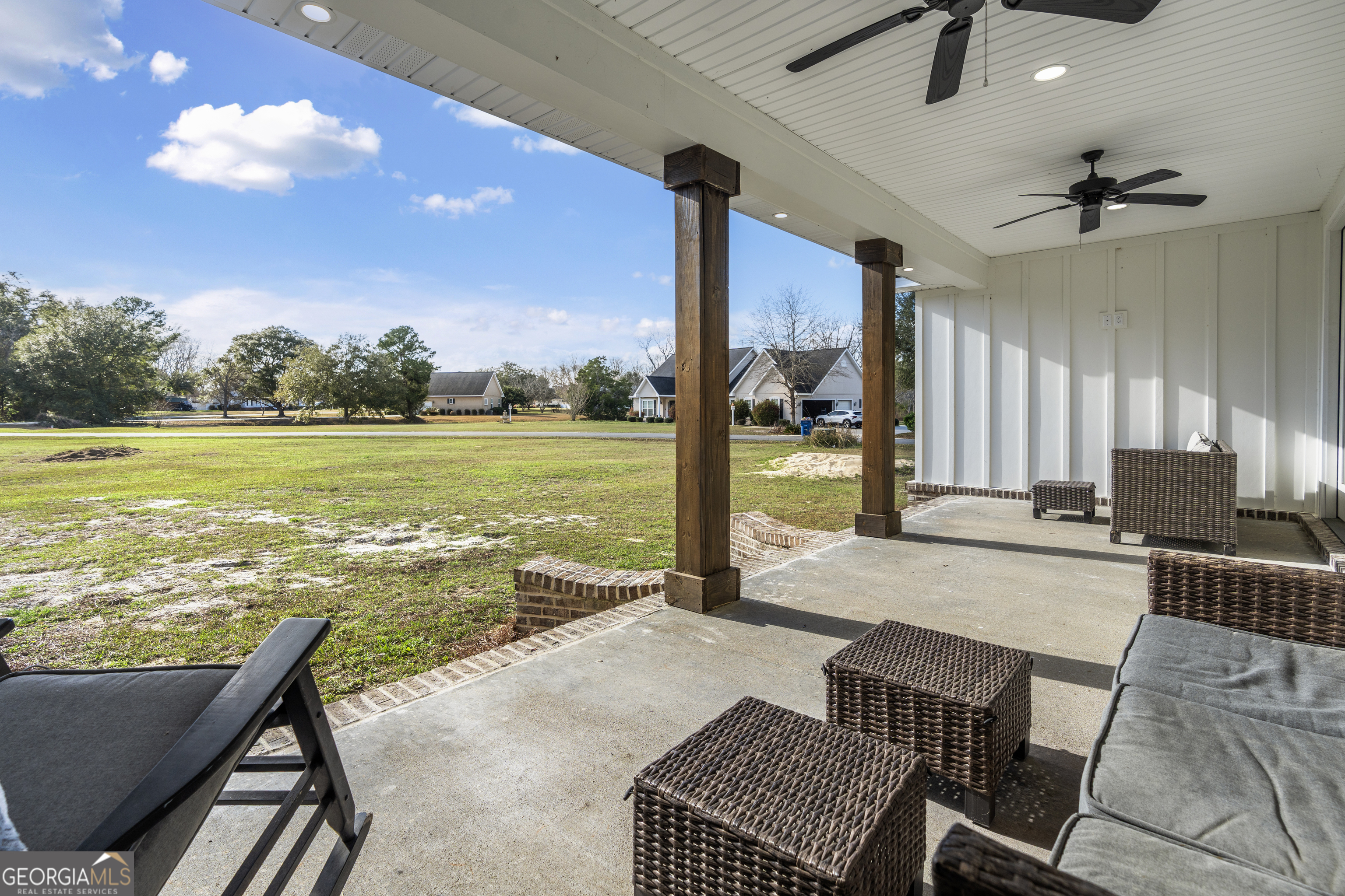 4005 Golfview Drive Blackshear, GA 31516 - Photo 4 of 40 a view of a livingroom with furniture wooden floor and a ceiling fan