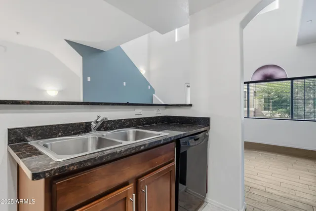 a kitchen with stainless steel appliances granite countertop a stove and a microwave