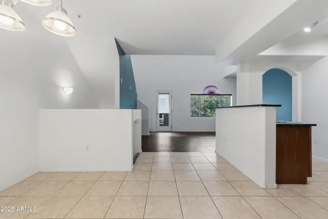 a view of a kitchen with a microwave and cabinets