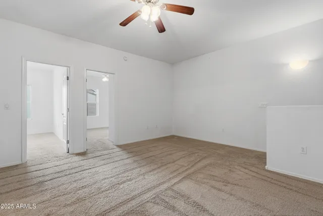 a view of a big room with carpet