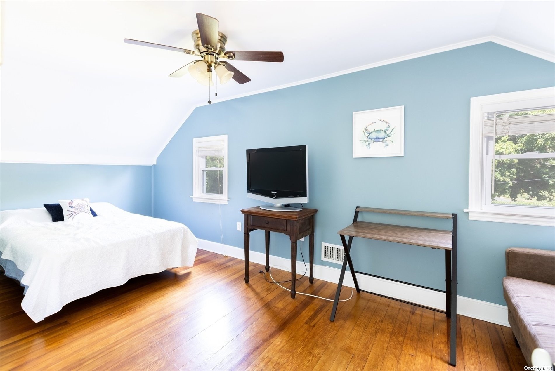 45 Southold, undefined 00000 - Photo 12 of 21 a bedroom with a bed and a table in it