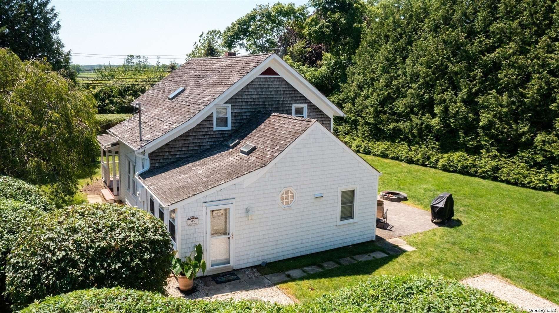 45 Southold, undefined 00000 - Photo 18 of 21 a view of a house with backyard and garden