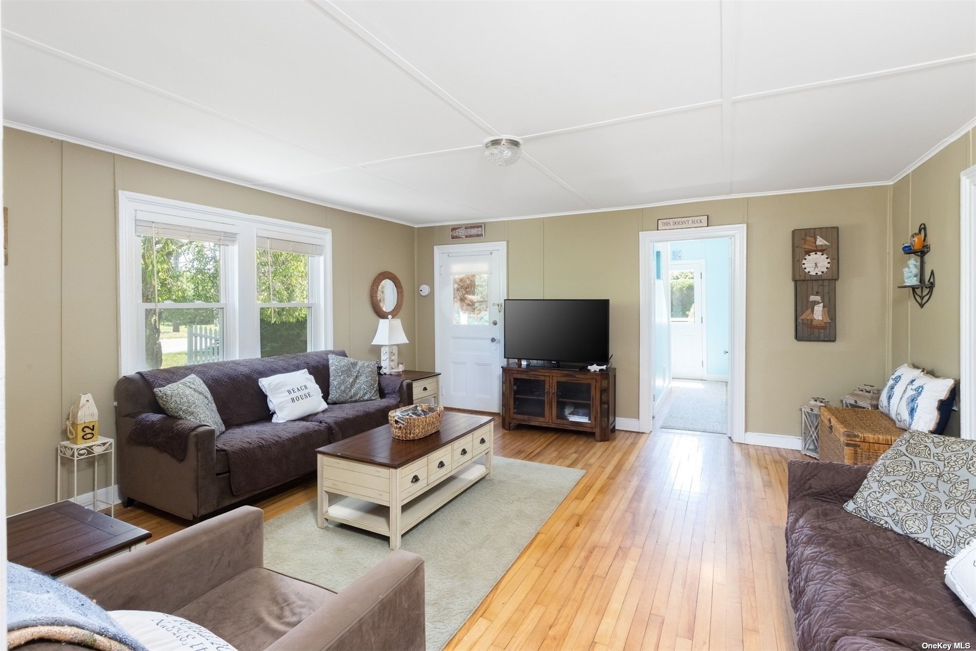 45 Southold, undefined 00000 - Photo 6 of 21 a living room with furniture and a flat screen tv