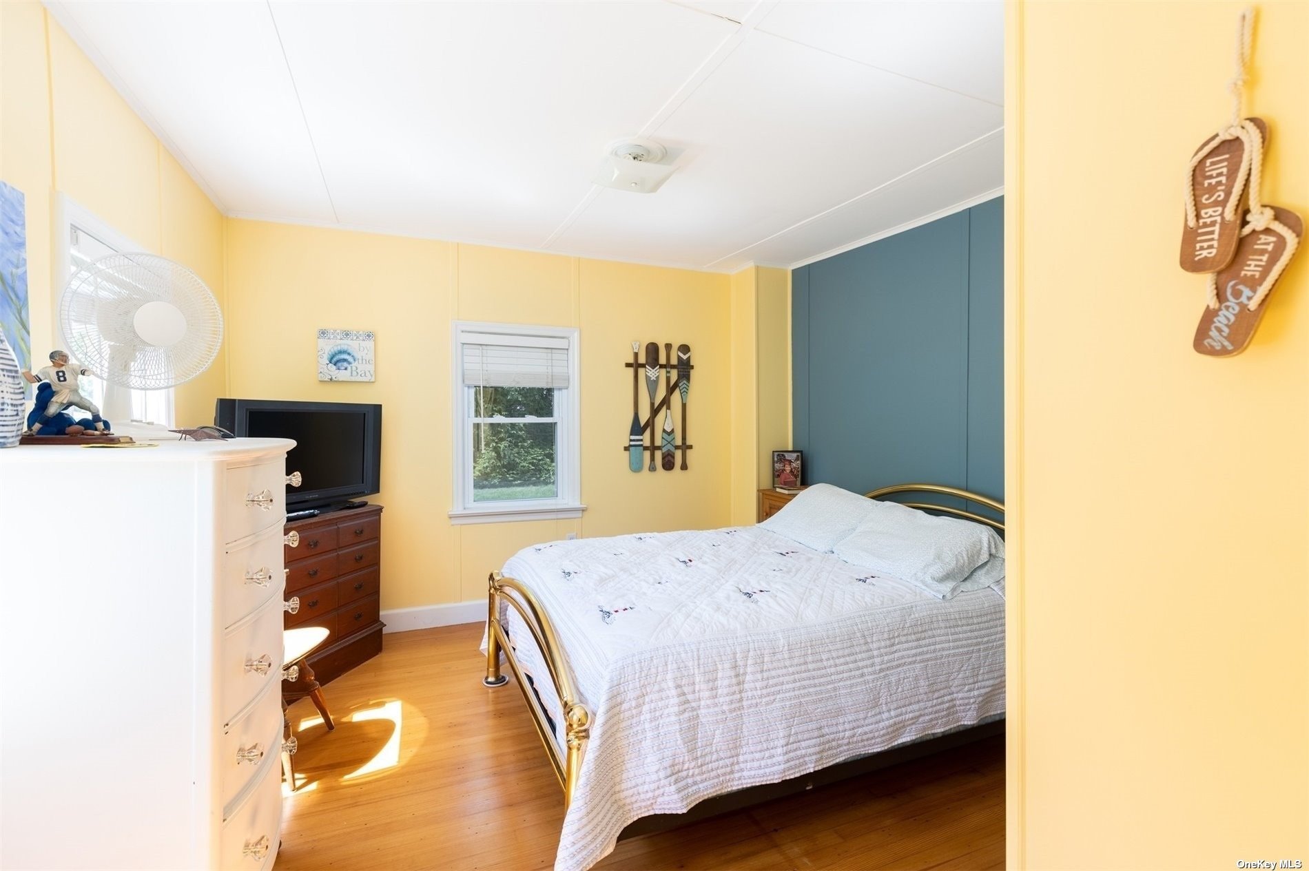 45 Southold, undefined 00000 - Photo 10 of 21 a bedroom with a bed and a flat screen tv