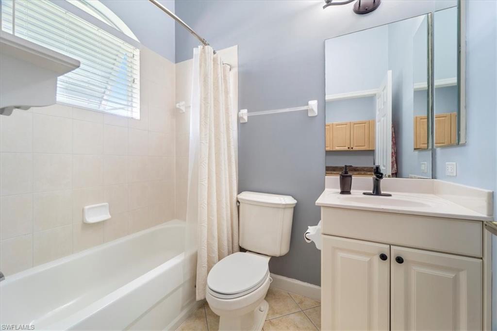 3343 Sandpiper Way Naples, FL 34109 - Photo 21 of 31 Full bathroom featuring tile patterned flooring, vanity, shower / bath combo, and toilet