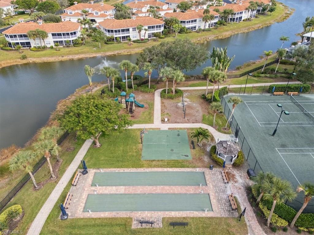 3343 Sandpiper Way Naples, FL 34109 - Photo 26 of 31 Drone / aerial view with a water view