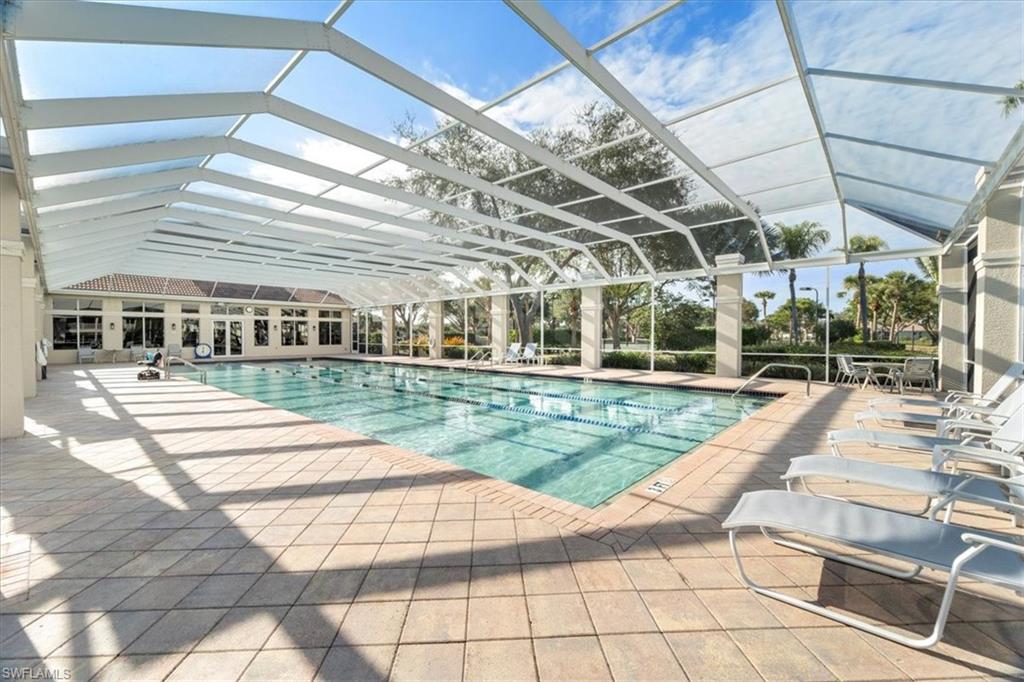 3343 Sandpiper Way Naples, FL 34109 - Photo 30 of 31 View of swimming pool with a patio and glass enclosure