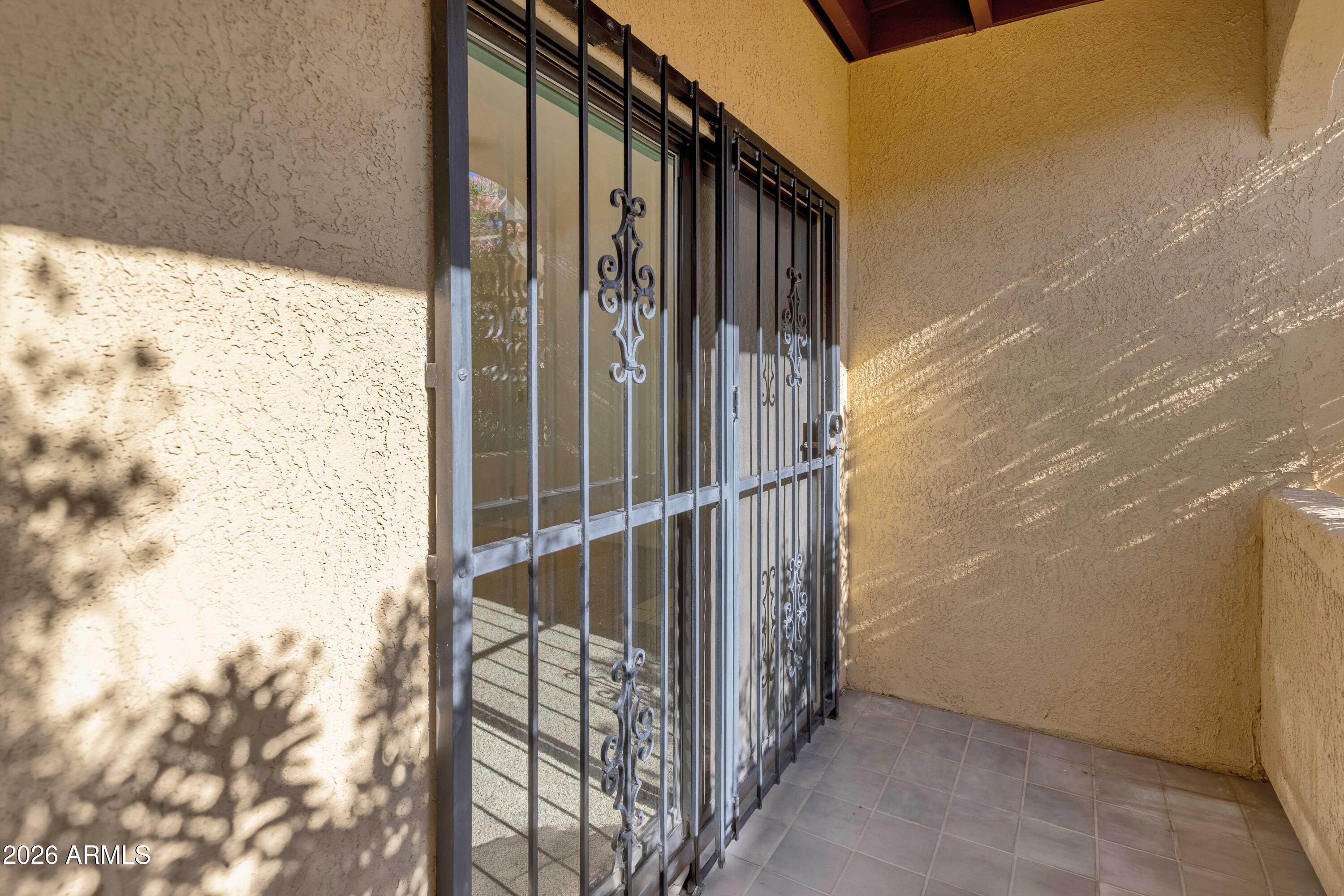 5500 North Valley View Road, Unit 101 Tucson, AZ 85718 - Photo 9 of 26 Sliding Door and Security to Covered Pat