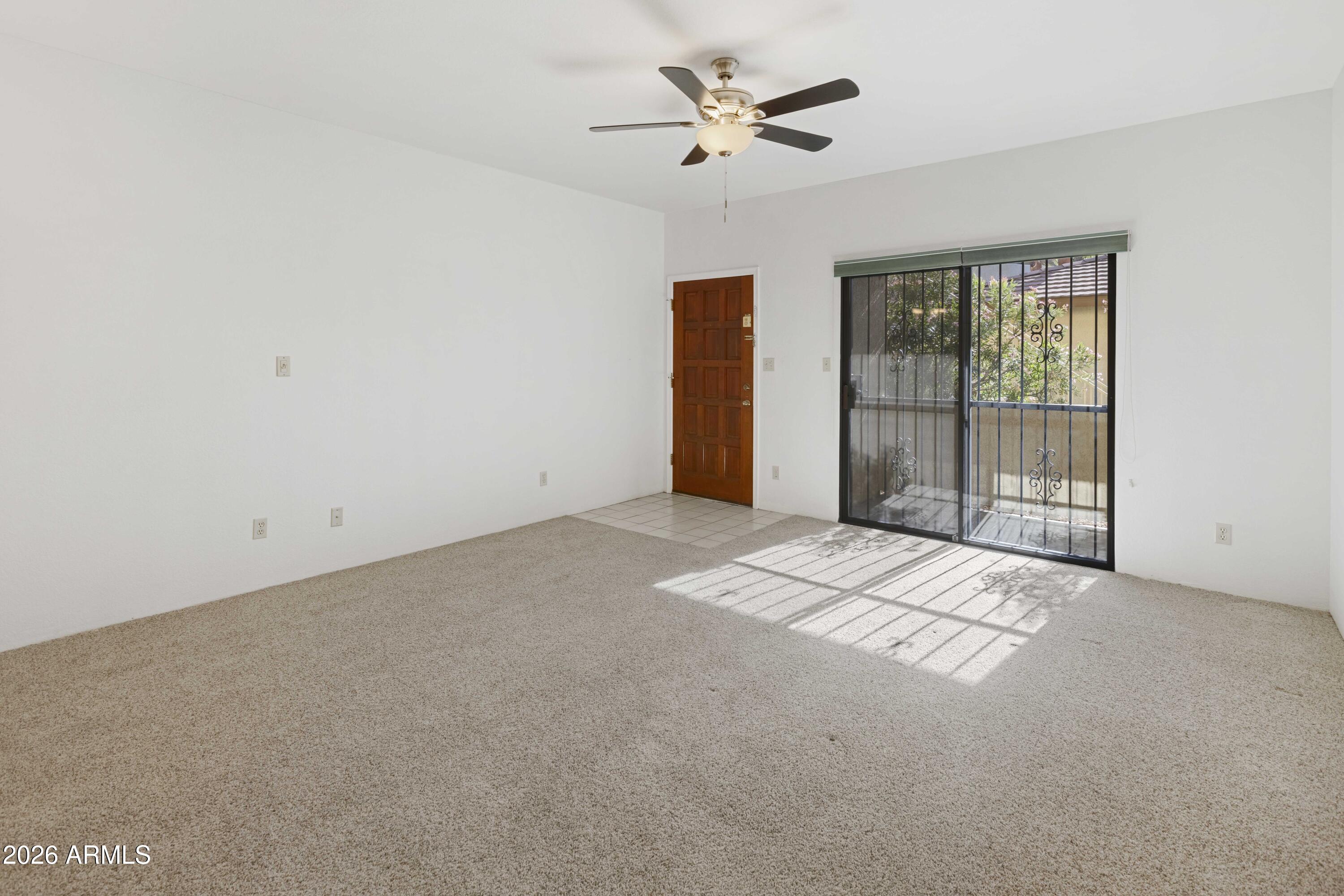 5500 North Valley View Road, Unit 101 Tucson, AZ 85718 - Photo 11 of 26 Great Room Towards Patio and Front Door
