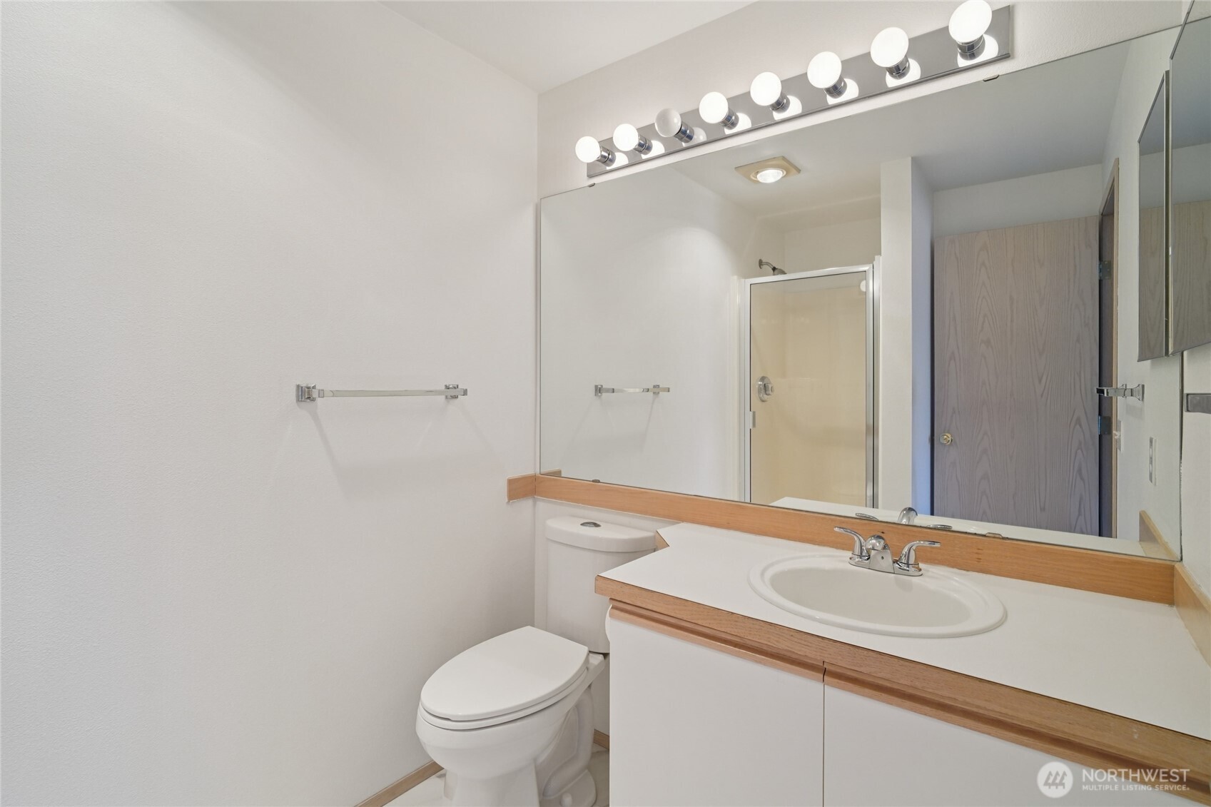 23628 55th Place South, Unit 153 Kent, WA 98032 - Photo 16 of 28 a bathroom with a sink and a mirror