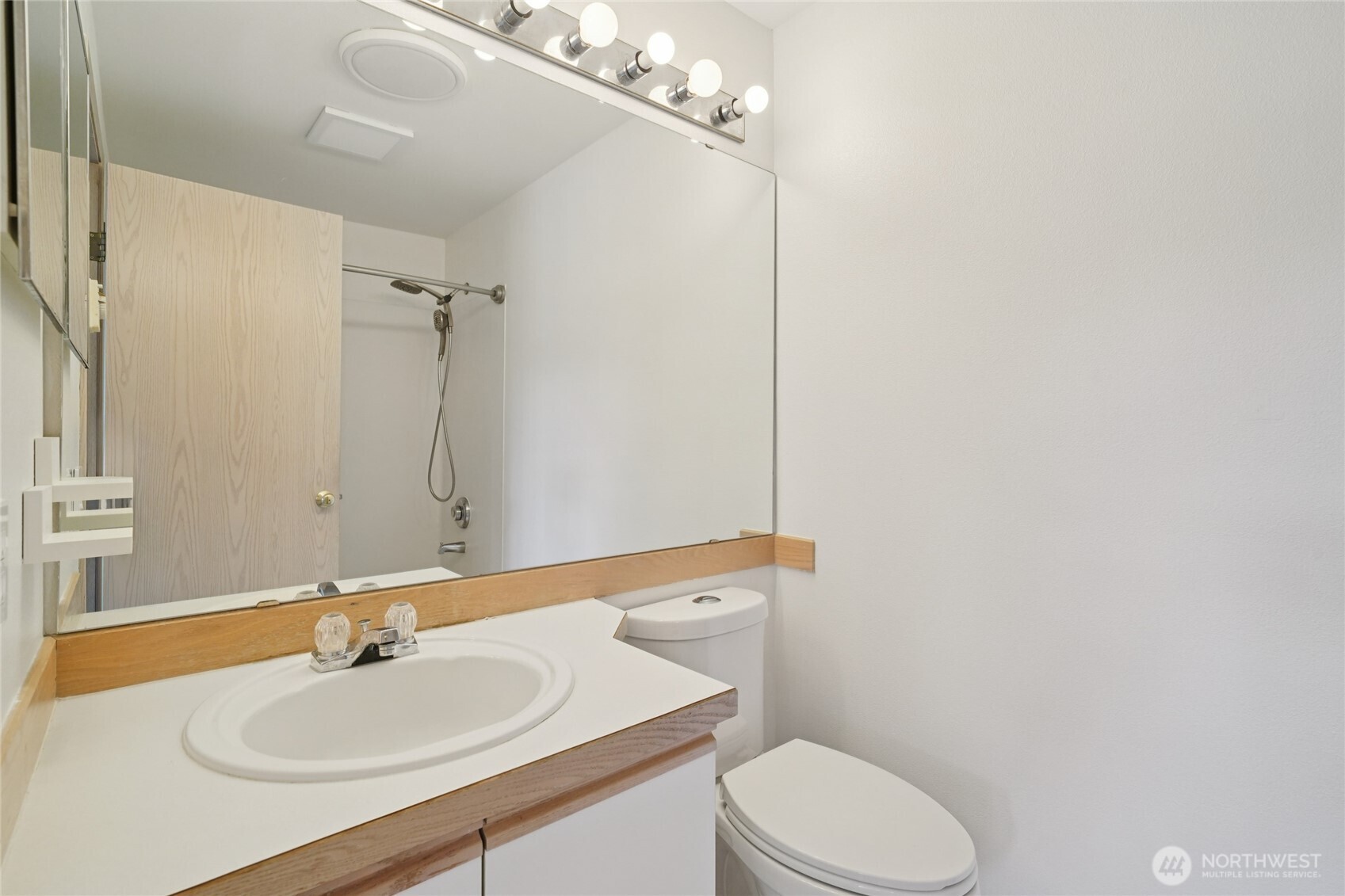 23628 55th Place South, Unit 153 Kent, WA 98032 - Photo 19 of 28 a bathroom with a sink toilet and mirror