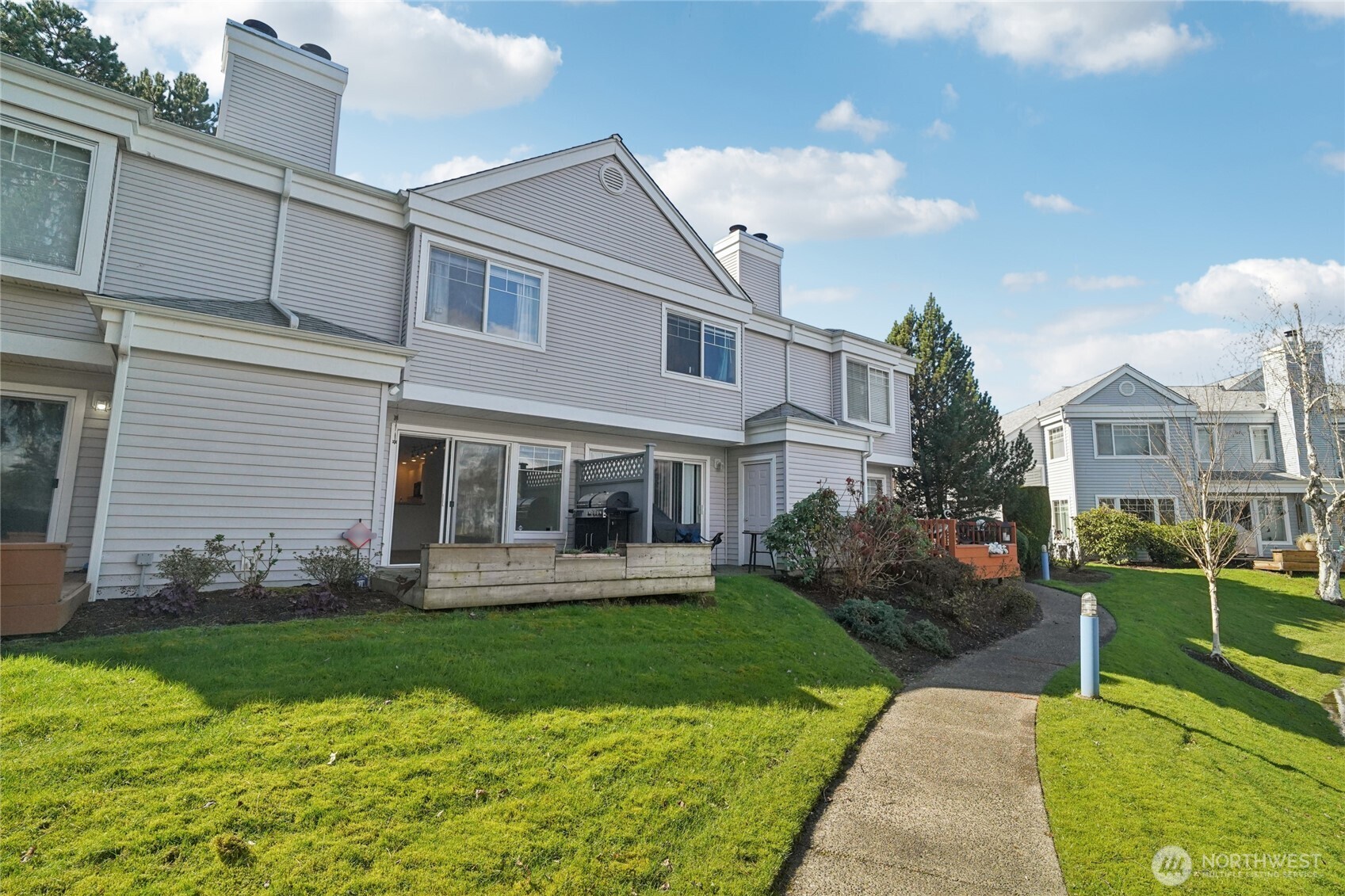 23628 55th Place South, Unit 153 Kent, WA 98032 - Photo 24 of 28 a front view of house with yard and green space