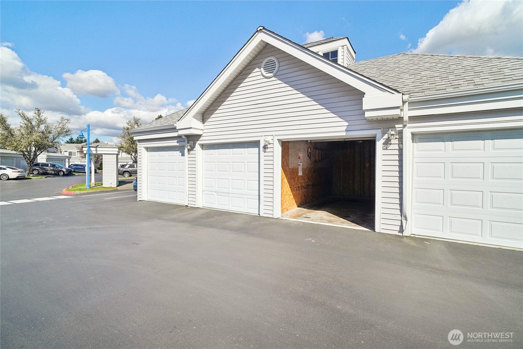 23628 55th Place South, Unit 153 Kent, WA 98032 - Photo 26 of 28 a view of a house with a garage